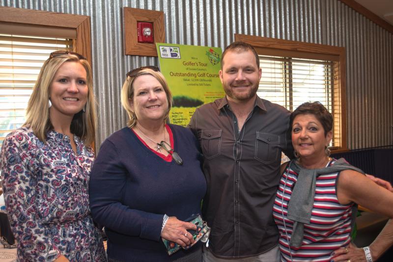 Laurie Vent, Barbara Jones Moore, Shaun Jones and Ceil Betts Jones gather at the fundraiser. Shaun is the founder of the event. BY DENY HOWETH